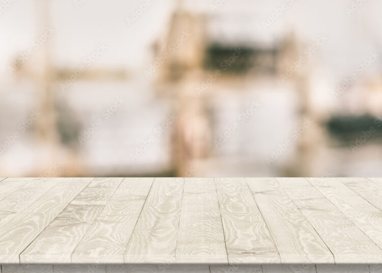 Fitted wooden worktop surface. Empty kitchen wooden table space platform.