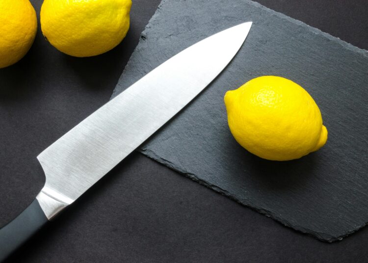 Photography of lemon near kitchen knife